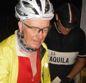 I arrive relieved and exhausted at the end of the L'Eroica 205km ride in 2012. Gary Smith from Yorkshire in the background checking he has all the stamps on his card. Thanks to Gary's brother for the photo - not at my best!